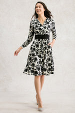 Black Gerbera Marilyn Dress with a floral print and a flattering silhouette.