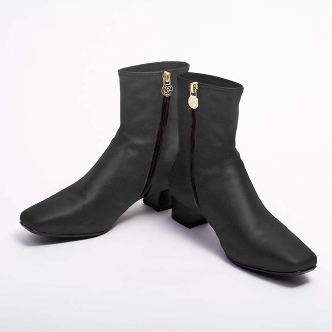 Black vegan suede fluffy flat boots with a soft, cozy appearance.