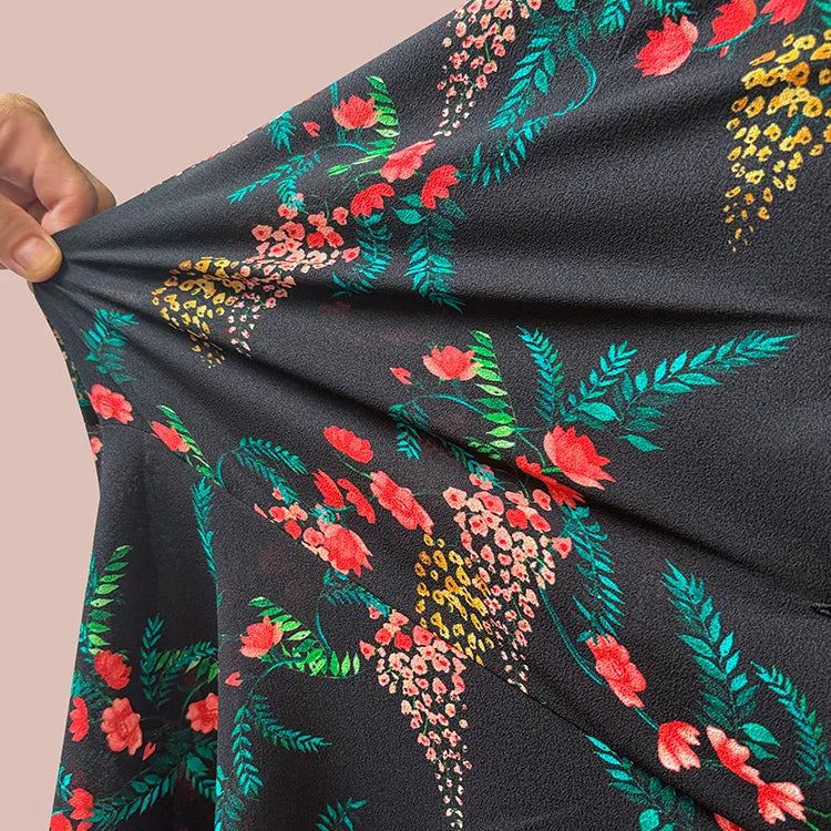 kay me's chiffon material is thin but highly stretchable. No shoulder stiffness.