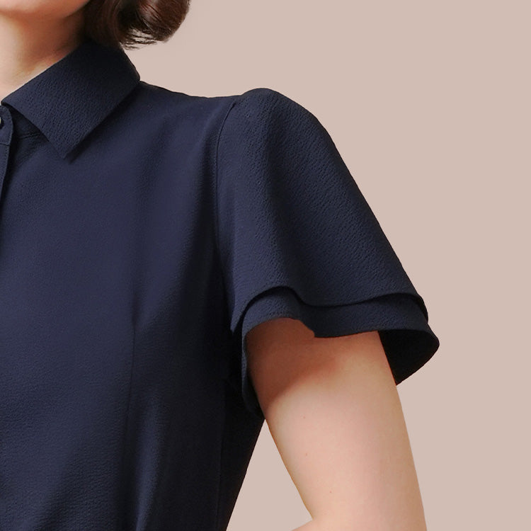 A sophisticated shirt dress that perfectly balances elegance with feminine allure
