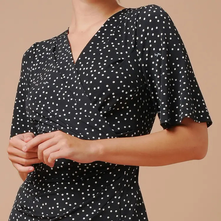Flared sleeves provide coverage for the upper arms.