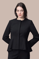 Model wearing a black Space Material Peplum Jacket, featuring a cinched waist and structured shoulders.