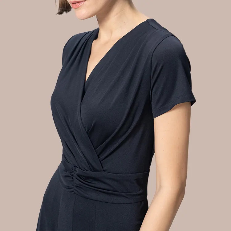 A delicate wrap top creates a three-dimensional bust line