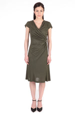Olive Waist Gathered Dress, sold out. A model wears the olive green midi dress with a gathered waist and V-neck.