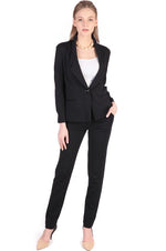 Black Tapered Pants, a close-up shot showing the fabric texture and stitching detail.