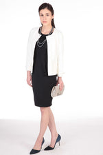 Black 3D Lightweight Stretch Dress, a form-fitting midi dress with a textured, dimensional fabric, sold out.