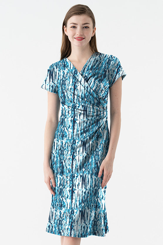 Model wearing a 4-Way Stretch: 4-Way Jersey Sunglint Gather Dress in a vibrant, shimmery fabric.