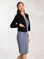 A blue washable knit dress with a crew neck and short sleeves.
