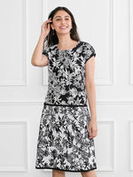 Black Lemon Knit Top, a washable knit garment with a black and yellow lemon print.