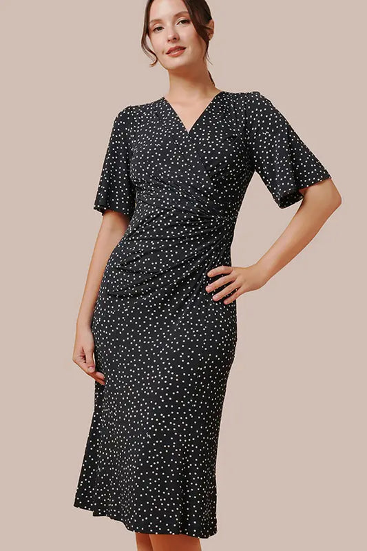 Navy dot gathered dress made from stretch jersey fabric.