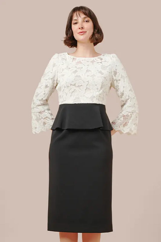 White and black lace peplum dress with docking detail, part of the Space Material x Lace collection.