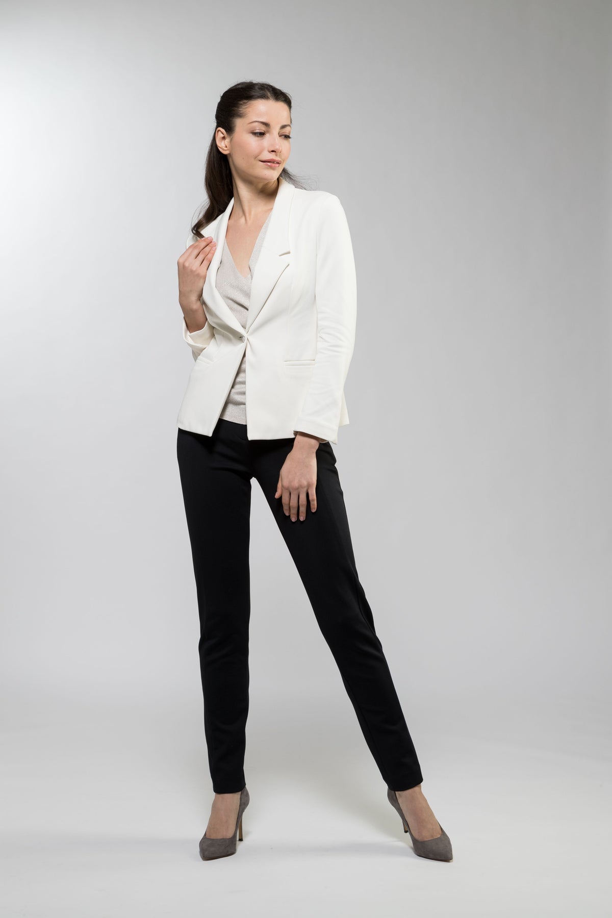 A White Stretch Tailored Jacket is shown from the front, highlighting its sleek design and flattering fit.