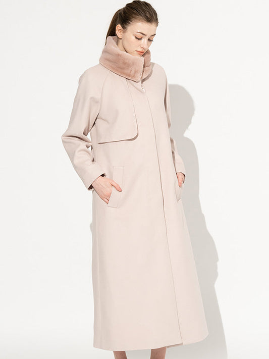 Fur Free: Smoky Pink Long Coat, a luxurious faux fur coat in a soft smoky pink hue, draped elegantly.