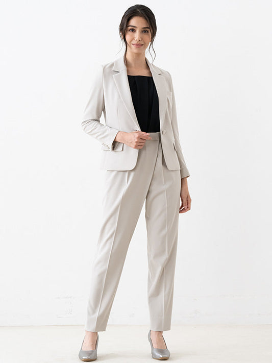 Smart Stretch Grey-Beige Wrap-Tuck Pants, showcasing a close-up of the fabric texture and draped front.