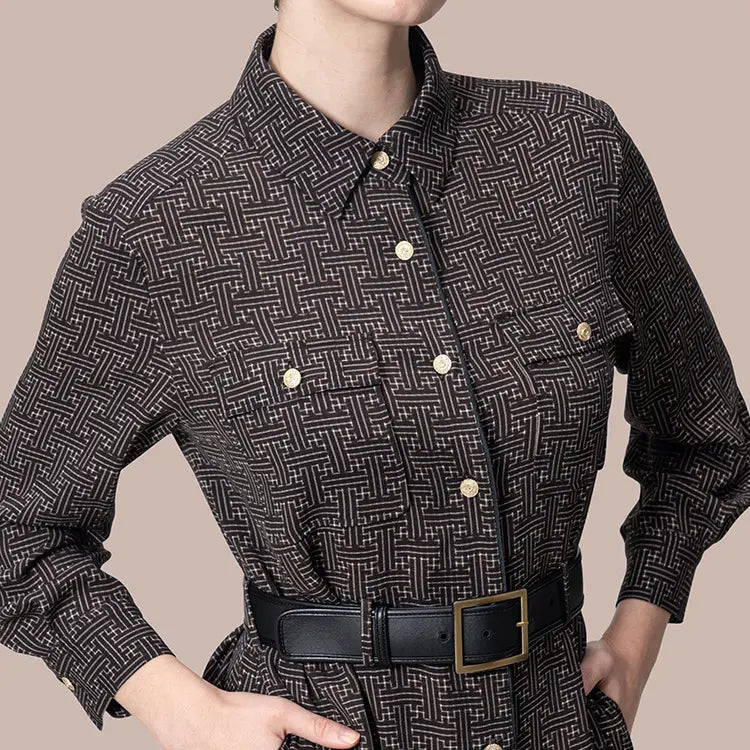 Sophisticated intellectual presence created by gold buttons and elegant black trim