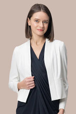 Smart Stretch bolero-length jacket in a soft, neutral fabric, featuring a cropped silhouette and open front.