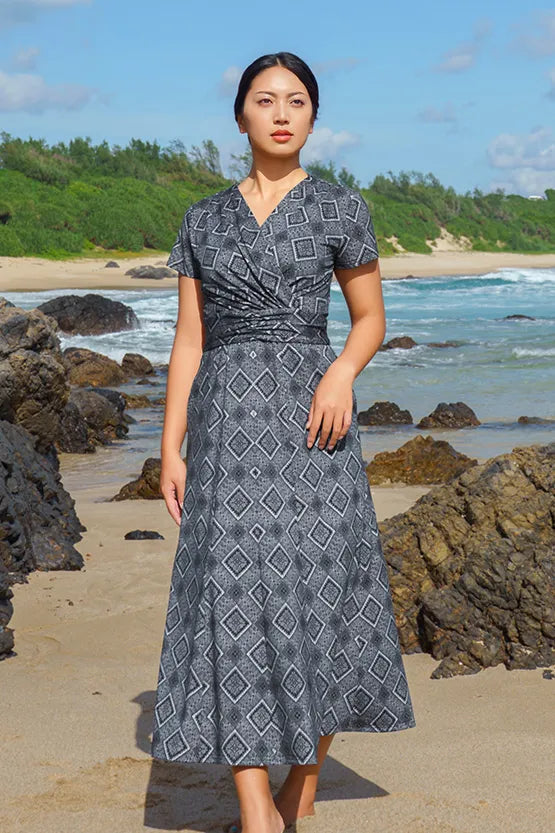 Oshima Tsumugi Design Stretch Jersey Long Marilyn Dress, featuring a dark, intricate Japanese textile pattern.