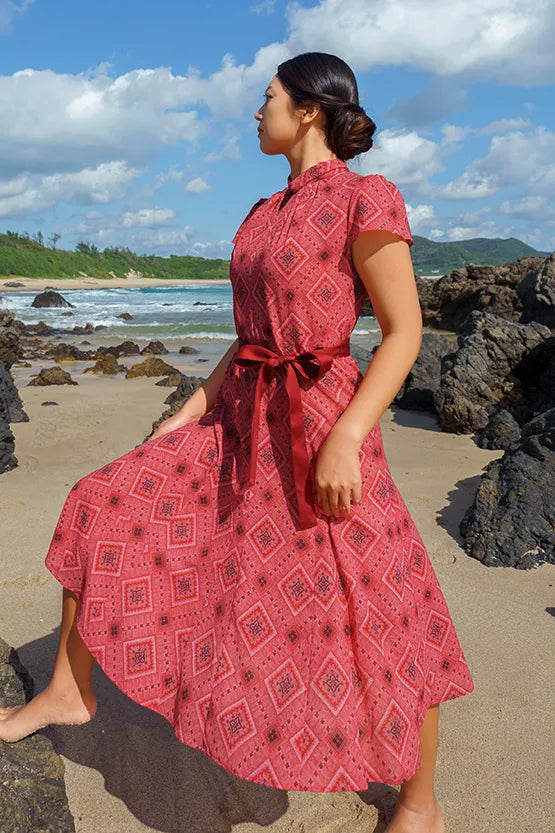 Oshima Tsumugi Design Stretch Chiffon Mid-Length Semi-Mermaid Dress in a rich, dark blue fabric with subtle weave patterns.