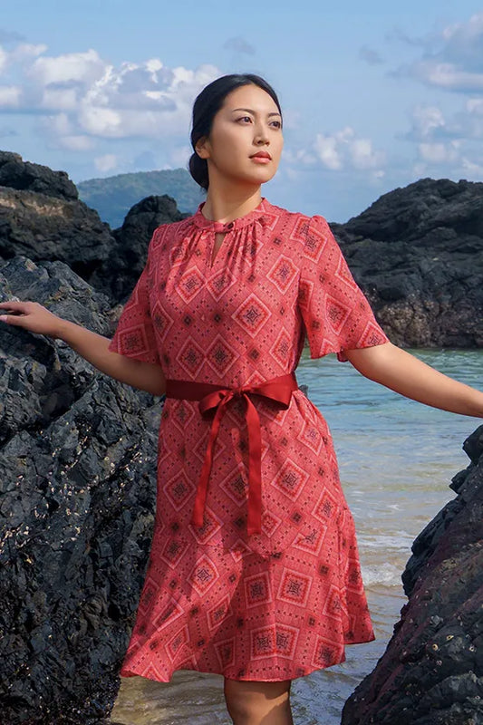 Knee-length Oshima Tsumugi Design Stretch Chiffon mermaid dress in a deep blue, featuring a subtle geometric pattern.