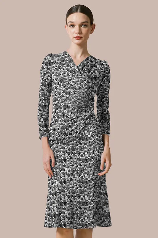 Gathered Stretch Jersey Dress: A woman models the gathered stretch jersey dress in a soft, neutral color.