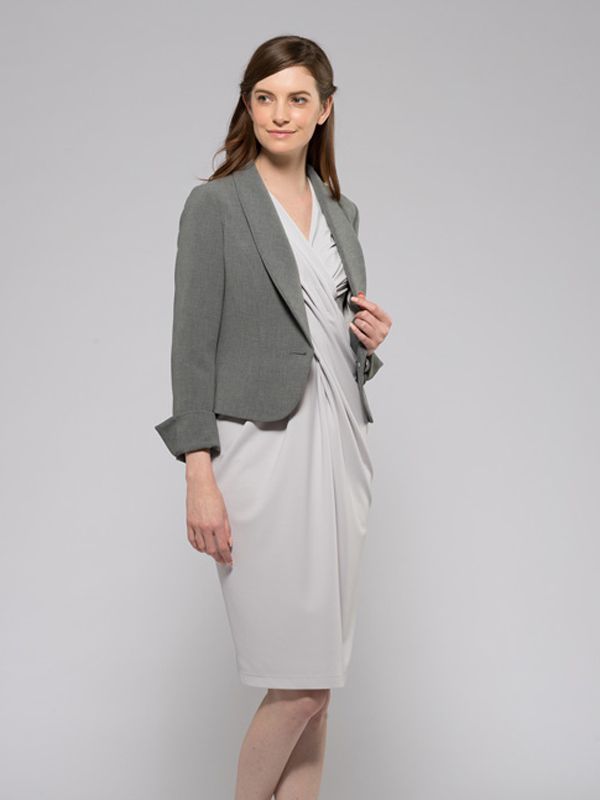Grey shawl collar short jacket with a textured fabric and a relaxed fit.