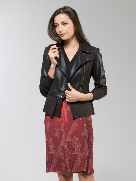Sunset Safari Wrap Dress with a vibrant orange and pink animal print, featuring a flowing silhouette and tie waist.