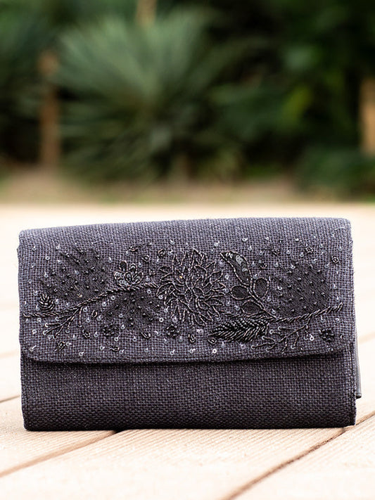 The Black Bijou 26-Pocket Bag is shown, a black fabric organizer with multiple clear plastic pockets.