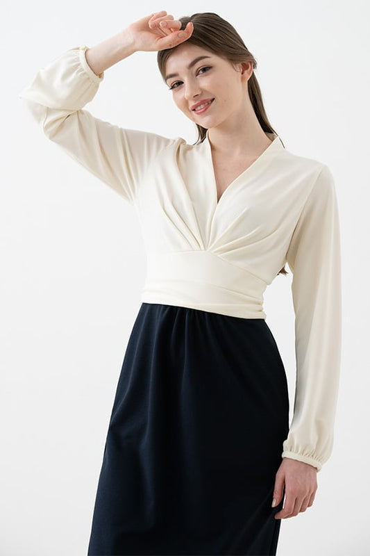 Ivory and navy Double Jersey: Ivory X Navy Docking Shell Dress, a sleeveless sheath dress with a navy neckline.