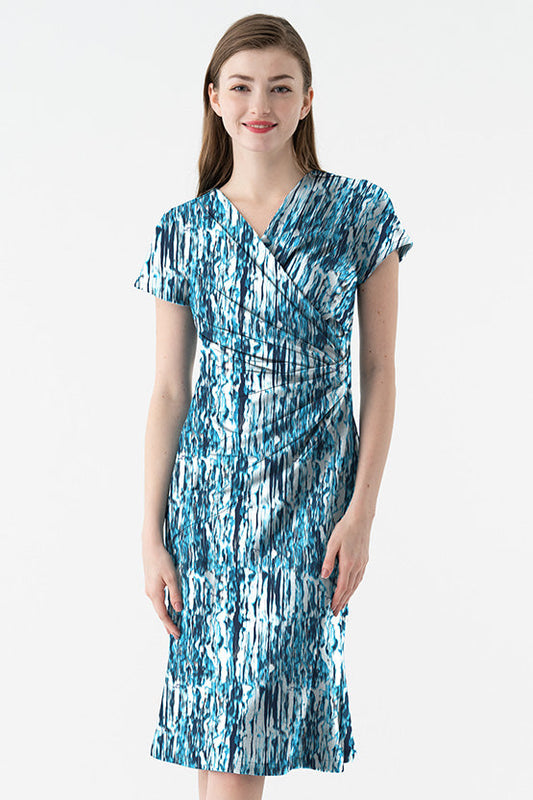 Model wearing a 4-Way Stretch: 4-Way Jersey Sunglint Gather Dress in a vibrant, shimmery fabric.