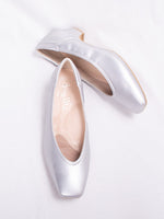 Fluffy silver vegan leather flats, showcasing a plush, textured design.