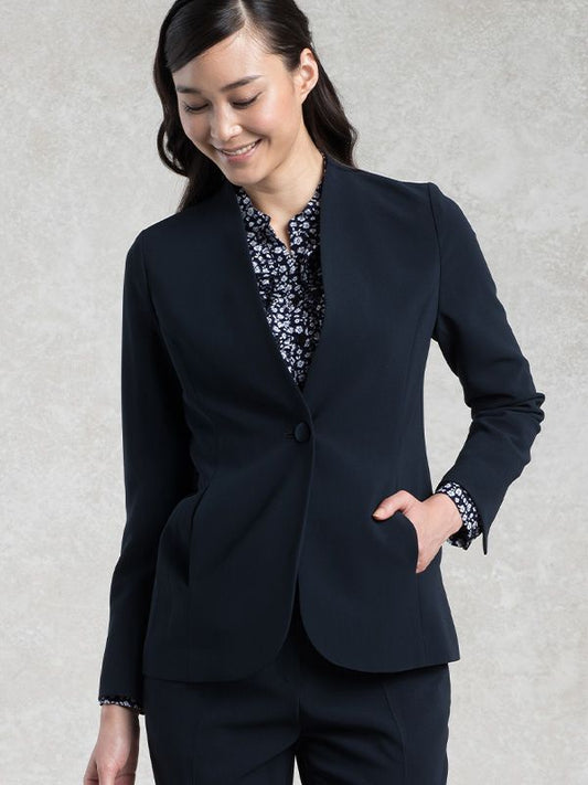 Navy long collarless jacket, a versatile outerwear piece.