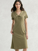 Khaki cotton shirt dress with a button-down front and collar, displayed on a hanger.