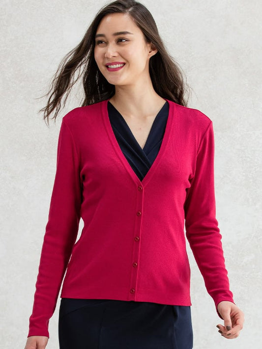 A close-up of a soft red V-neck cardigan, showing the knit texture and button detailing.