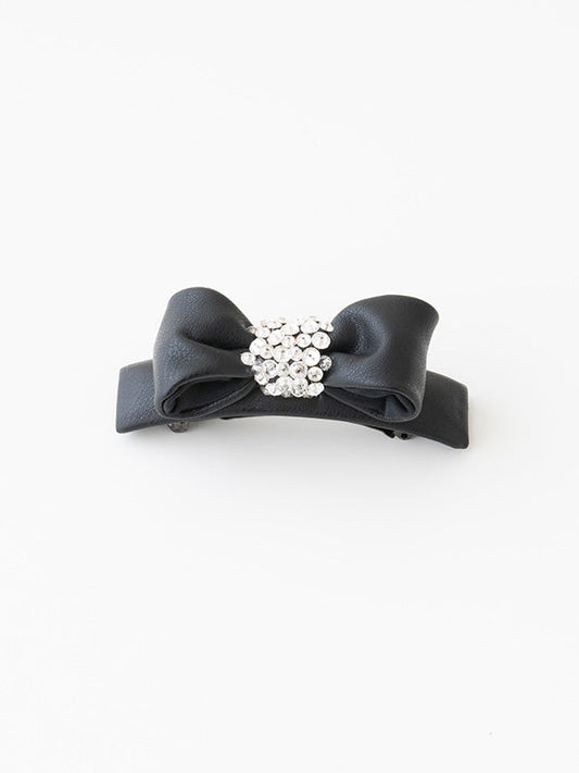 Black vegan leather "puffy" ribbon barrette, a soft, padded hair accessory.