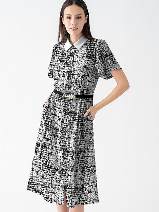 Woman wearing a black-and-white patterned dress