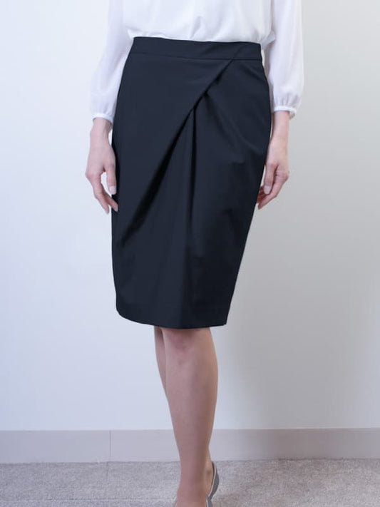Stretch Jacquard Navy Design Tuck Skirt shown in a flattering A-line silhouette with subtle texture.
