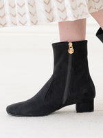 Black vegan suede fluffy flat boots, cozy and stylish for everyday wear.