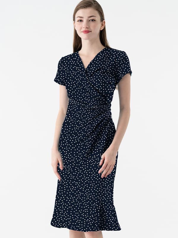 Navy Tiny Dot Gathered Dress with short sleeves and a cinched waist in a fine navy and white dot pattern.